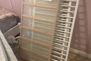 white cot with mattress