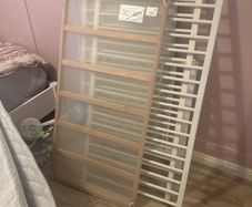 white cot with mattress
