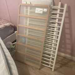 white cot with mattress