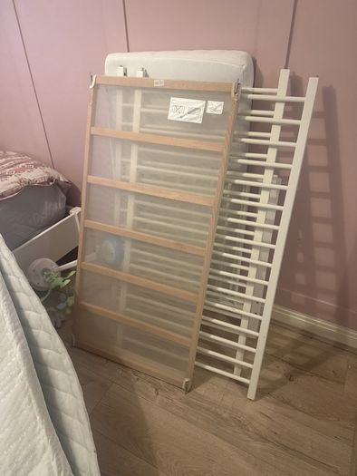 white cot with mattress