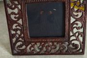 Cast iron photo frame with a rust finish, rustic style decoration. Dimensions: 15x15 cm. Photo dimensions: 7x7 cm.