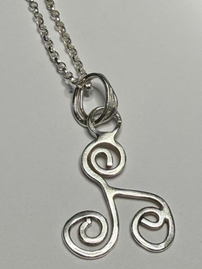 Sterling silver Triskele pendant on 18 or 20 inch chain.