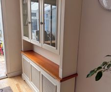 Radiator cover and display unit