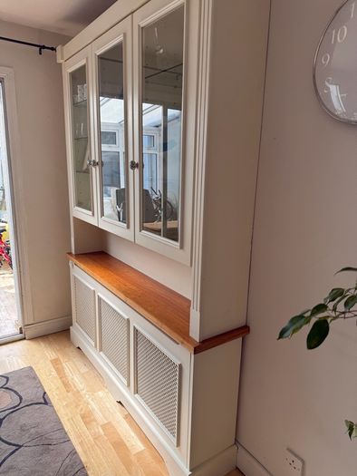 Radiator cover and display unit