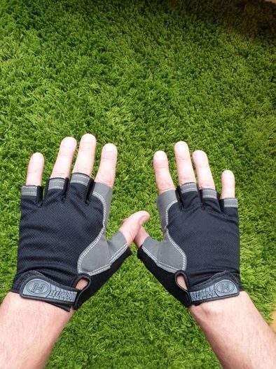 Gym gloves. Fingerless gloves. Cycling gloves. Work gloves. Carpenter gloves. Weightlifting. Workout.  Fitness.  Bodybuilding