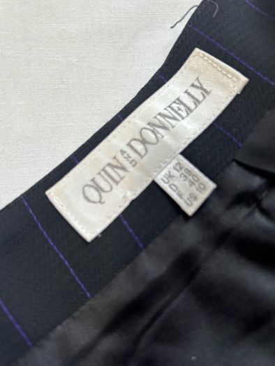 Quin and Donnelly Black with purple pin stripe and panel skirt