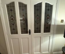 Antique white deal double doors with stained glass