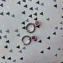 A beautiful pair of  sterling silver hoop earrings featuring small encrusted zircons and a dazzling ruby pink halo pendant. Image 5