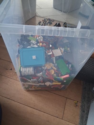 Big box of lego with mini figurines open to offers