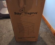 Baby changing table and two nappy bins