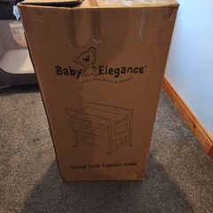 Baby changing table and two nappy bins