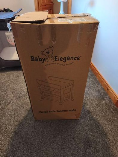 Baby changing table and two nappy bins