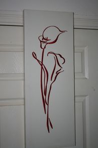 Embroidered flowers on a wall picture