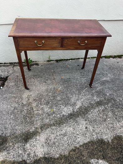 Maghoney wine leather desk with 2 drawers. Inlaid