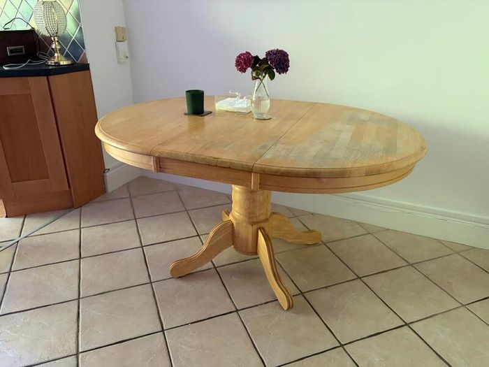 Solid wood pedestal dining table