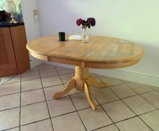 Solid wood pedestal dining table