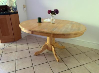 Solid wood pedestal dining table