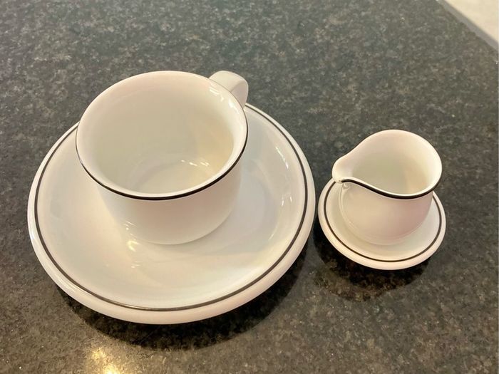 Coffee cup and cream jug