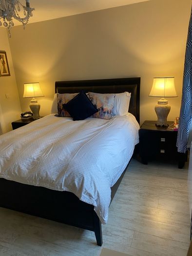 king size bed with matching lockers and lamps