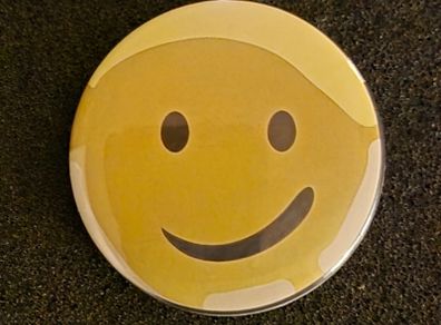 Smiley face, pin back button badge.