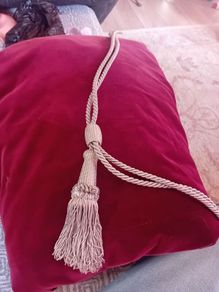 Long red velvet curtains with tie backs