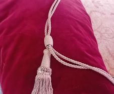 Long red velvet curtains with tie backs