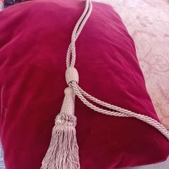 Long red velvet curtains with tie backs
