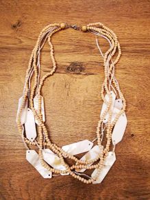 Necklace with wooden beads and sea shell elements