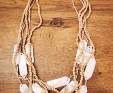 Necklace with wooden beads and sea shell elements