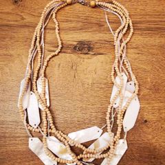 Necklace with wooden beads and sea shell elements