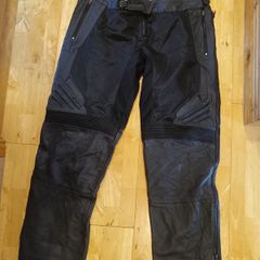 Brand new Icon leather motorcycle overpant adjustable between 38 and 42 waist