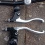 Handlebars, brake levers, hand grips. Image 8