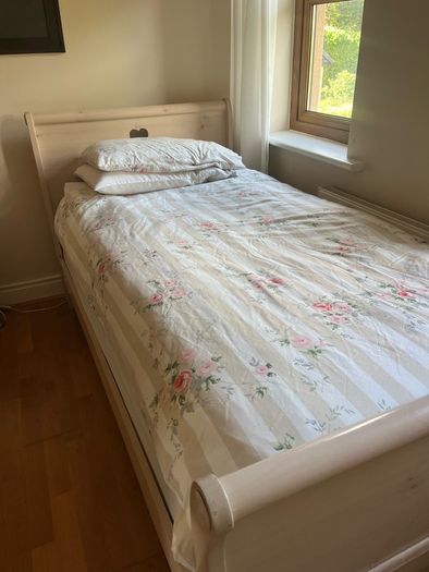 Beautiful cream single sleigh bed. Mattress included.