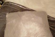 2 grey fur/fluffy cushions