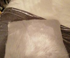 2 grey fur/fluffy cushions