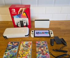 Nintendo Switch OLED (plus 3 games and travel case)