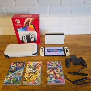 Nintendo Switch OLED (plus 3 games and travel case)