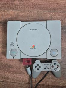 playstation 1 console with controller