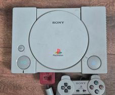 playstation 1 console with controller