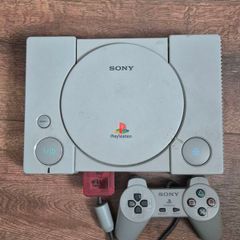 playstation 1 console with controller