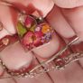 Handcrafted 925 sterling silver necklace with a heart-shaped pendant featuring a floral pattern. Image 7