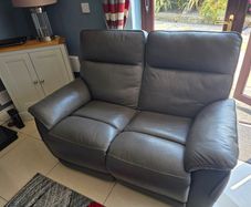 Small dark grey leather sofa for sale