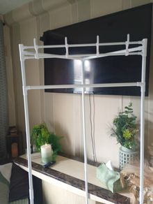 coat hat and clothes rail