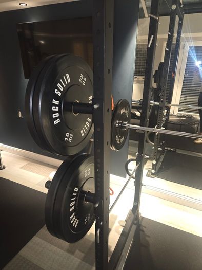 Mint condition - amazing heavy duty black squat rack with almost brand new Rock Solid barbell and bumper plates - a must see!!!