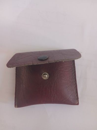 Title: Authentic Jerusalem Olive Wood Rosary & Leather Case  Description: Selling an authentic Catholic rosary made from Holy Land olive wood beads. The back of the crucifix is stamped "JERUSALEM", and the center medal is stamped "TERRA SANTA" with a 
