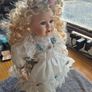 Vintage Irish Porcelain Doll with Flower Wreath and Pinwheel Vintage Image 2