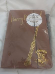 Harry Potter notebook and wand.