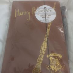 Harry Potter notebook and wand.