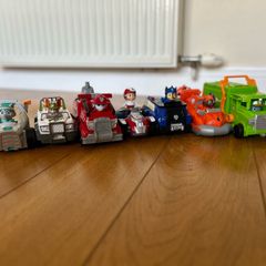 9 paw patrol characters with vehicles.