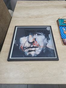 framed Leonard Cohen picture.